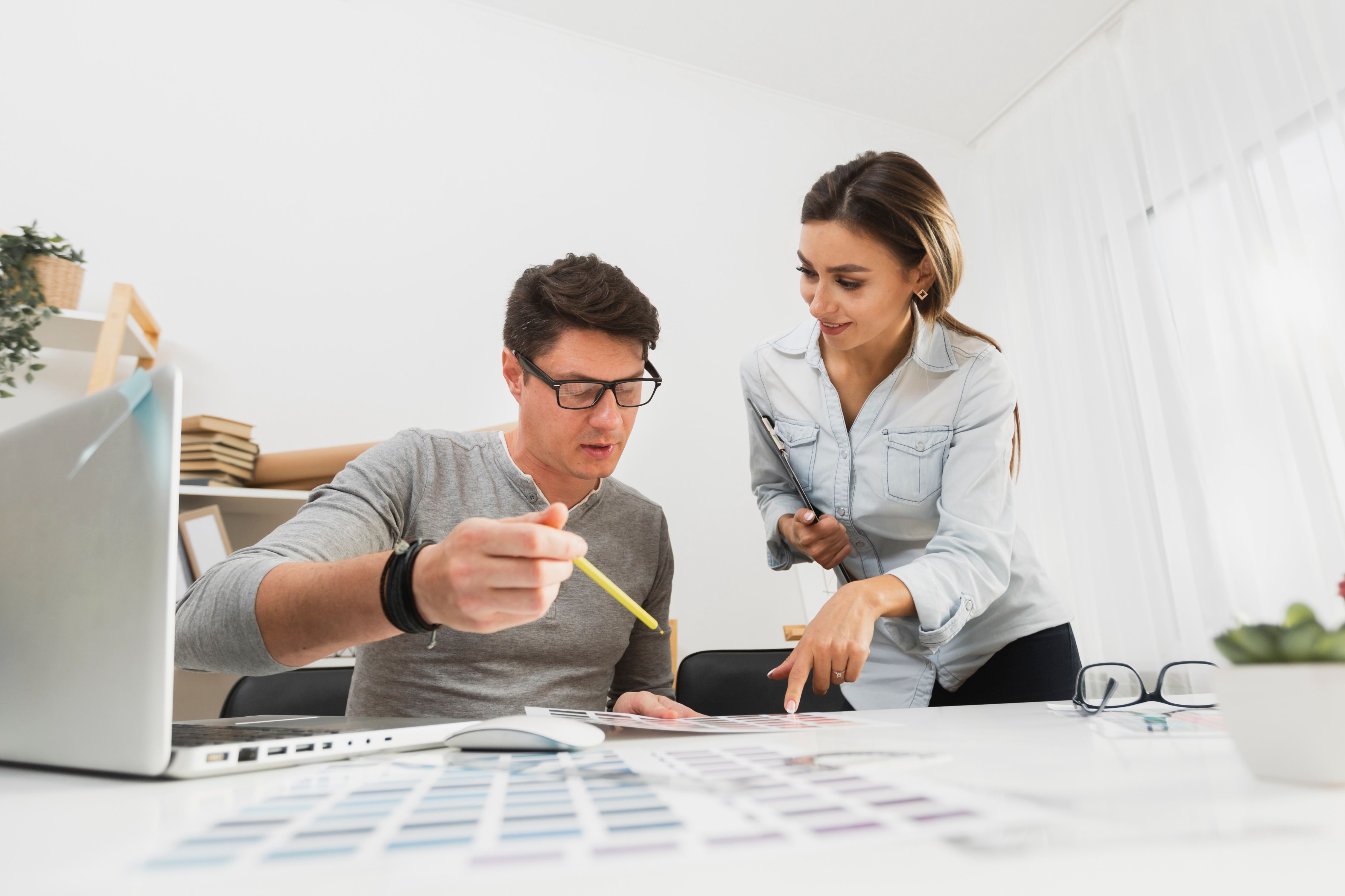 front-view-man-woman-working-business-papers.jpeg